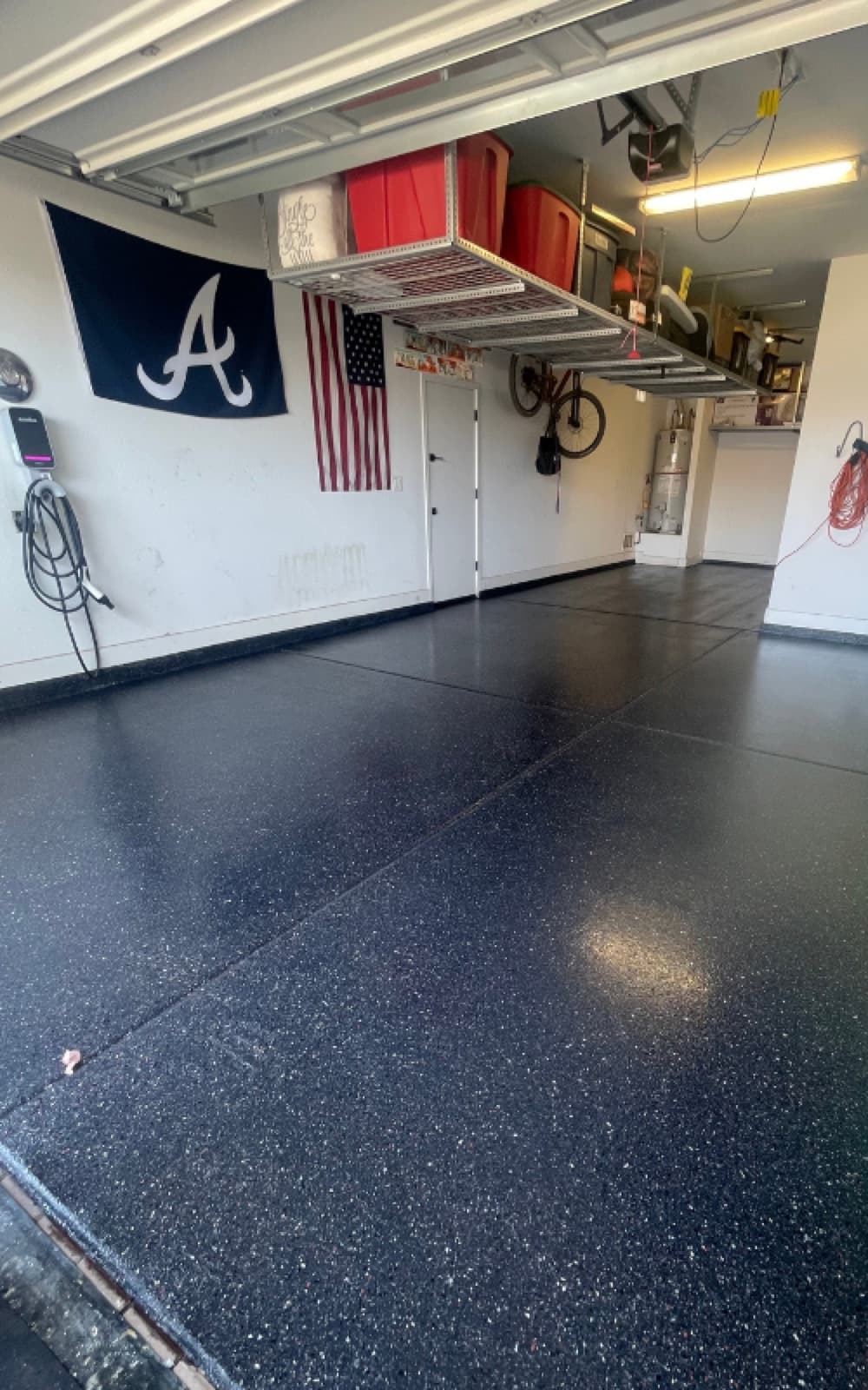 Finished dark flake garage floor coating ready for everyday use