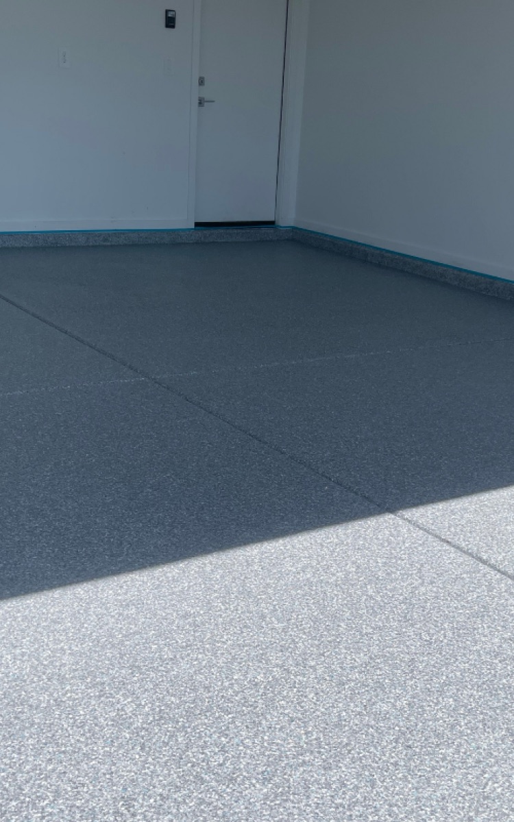 Kiwi Coatings garage floor coating detail with decorative broadcast finish
